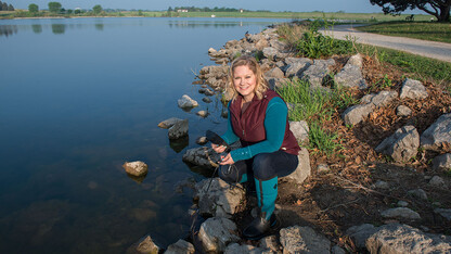 Tiffany Messer, assistant professor of biological systems engineering at the University of Nebraska–Lincoln, tests water in Lincoln’s Holmes Lake in May 2018. Messer’s research is included in the new traveling exhibition “H2O Today,” which opens Jan. 26 at the University of Nebraska State Museum at Morrill Hall.