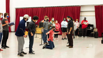 A group of cast members in Mozart's "The Magical Flute" run through music and choreography during a rehearsal Oct. 15.