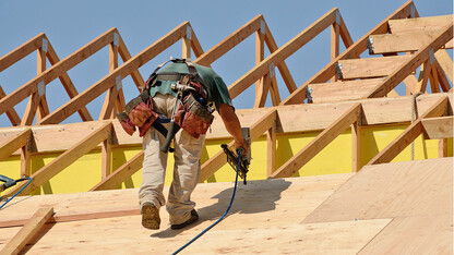 Man working on roof construction