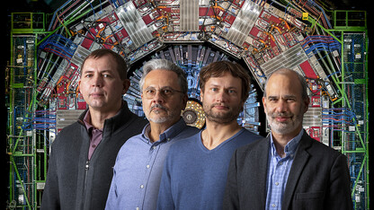 Ilya Kravchenko, Daniel Claes, Frank Golf and Ken Bloom are members of Nebraska’s Department of Physics and Astronomy who collaborate with partners at the European Organization for Nuclear Research, known as CERN. Their work involves CERN’s Large Hadron Collider, an image of which is behind the researchers in this photo.