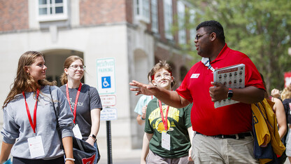 Orientation leader Jayven Brandt shares his experiences as a Husker with incoming freshmen outside the Nebraska Union in June 2021. Orientation leaders help welcome more than 4,500 students and their family members to campus during the Office of New Student Enrollment’s flagship summer program.