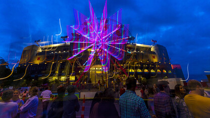 The east side of Memorial Stadium is illuminated by a Ferris wheel during the 2021 Cornstock Festival. The 2022 festival is 4 to 8 p.m. Oct. 1, again on the East Stadium Plaza.