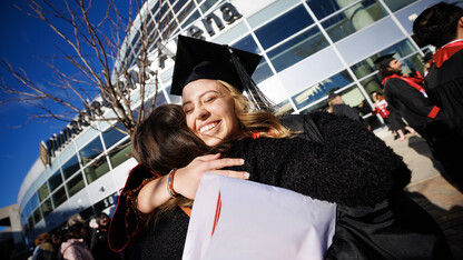 Graduate Marissa Heimes hugs a friend after the undergraduate commencement ceremony Dec. 17 at Pinnacle Bank Arena. Heimes earned a bachelor’s degree in nutritional science and dietetics.