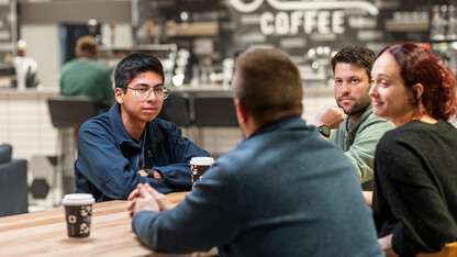 Carlos Ortega (left) and Julia Barrett (right) meet with Josh Monroe and Tom Whisinnand, teachers in the Omaha metro and co-hosts on the podcast "What the World Needs Now," to discuss what teaching looks like for them in Nebraska.