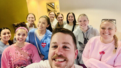 A group photo of Husker students helping at the 2023 Masters Tournament.