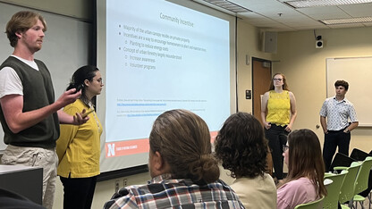 Four Husker students — two young men and two young women — present an urban forestry plan for Hickman, Nebraska. From left are Jake Fleischer, Susana Moyer, Sunny Mellick and Josiah Nolting.