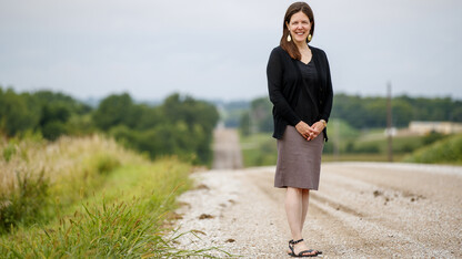 Jessica A. Shoemaker, Steinhart Foundation Professor of Law, stands on a gravel road.