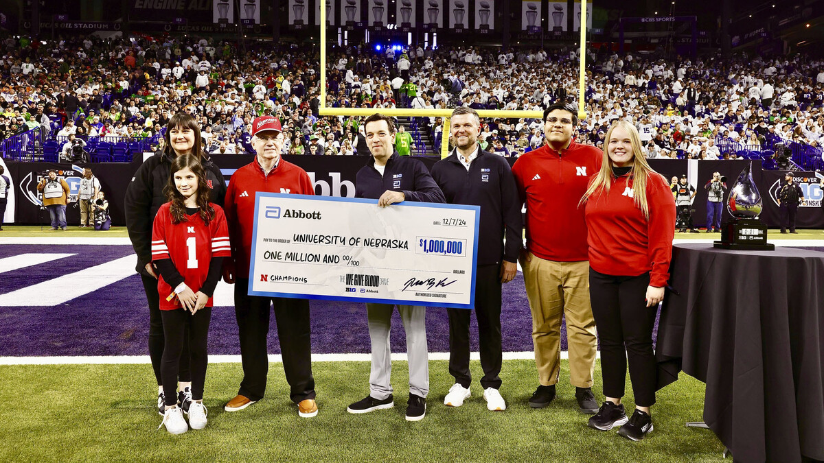 Representatives from the University of Nebraska pose with a $1 million check from Abbott.