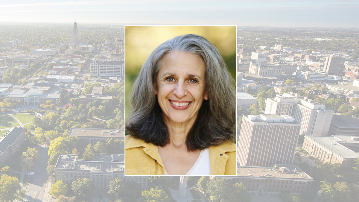 Color portrait of Tamar Haspel, food columnist for The Washington Post, on a color campus background.