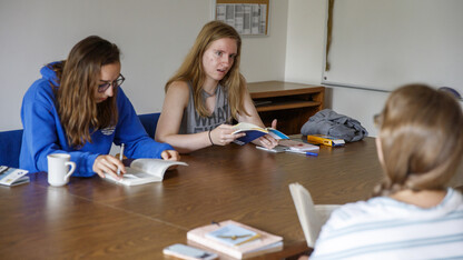 Literature students sit around a table at Cedar Point Biological Station.