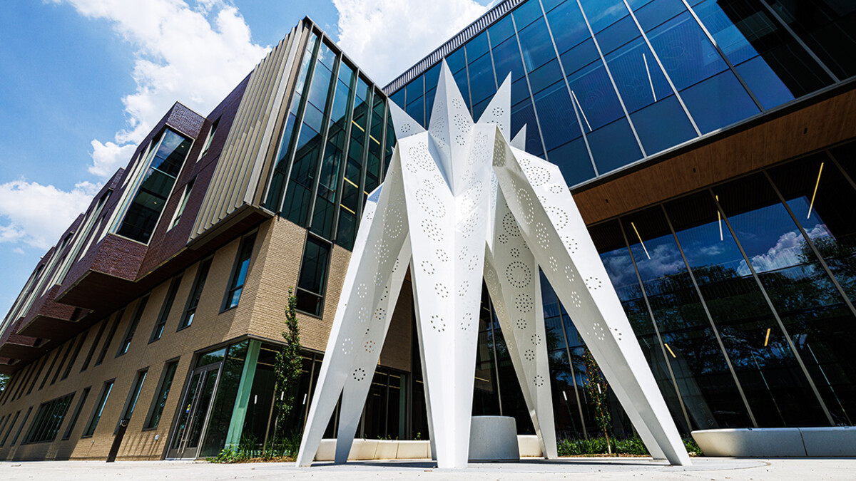 T.I.E. sculpture stands in front of Carolyn Pope Edwards Hall