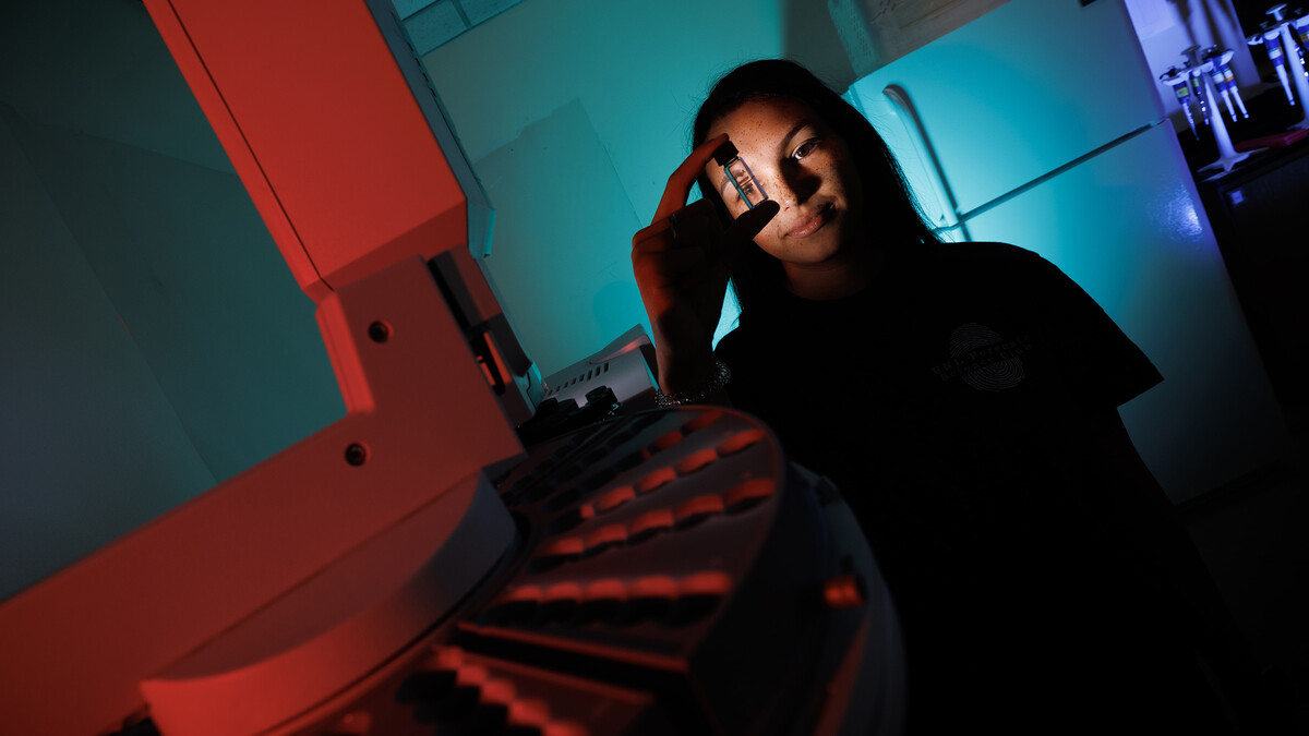 Anastasia Spruce looks through a vial for a gas chromatography mass spectrometrer in Filley Hall. Spruce, a senior in forensic science and and biochemistry, interned this summer with the Orange County (Florida) Sheriff Office.