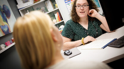 Meagan Savage talks with Camryn Kelly, a junior from El Dorado Hills, California, during an advising session.