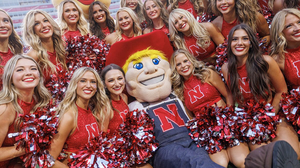 Herbie poses with the Cheer Squad during the home opener for the Husker football team.