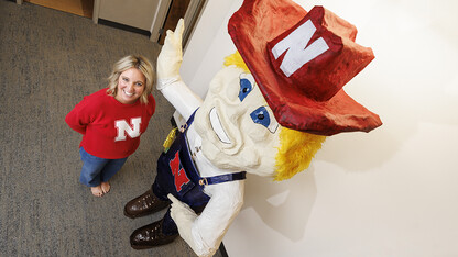 Ashley Dohe, administrative coordinator for Electrical & Computer Engineering, has make an 8-foot tall Herbie Husker from paper mache.  She hopes to auction it off to help veterans.