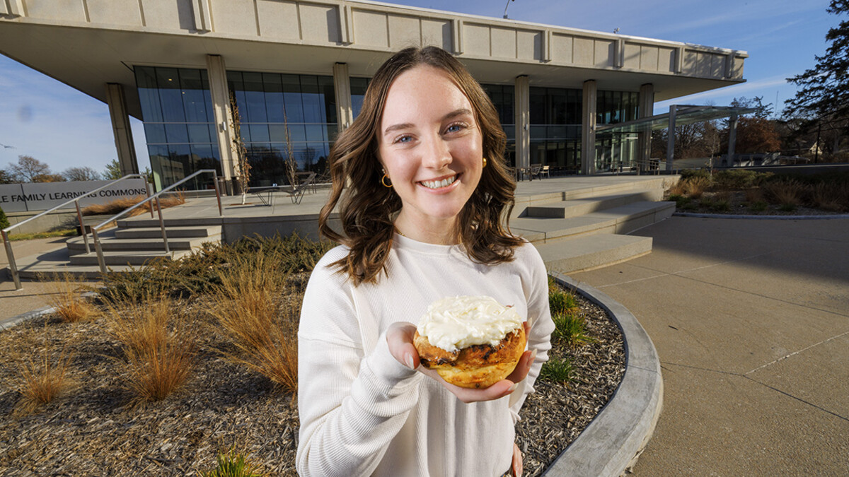 Alexa Carter holds her chili roll creation.