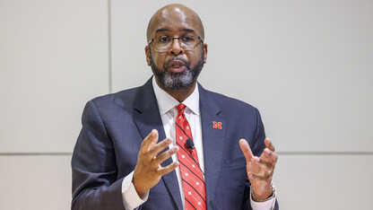 Chancellor Rodney D. Bennett gestures during his Feb. 15 Charter Day address to university leaders. The presentation was held in the Nebraska Union's Swanson Auditorium.