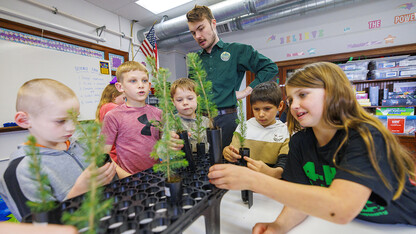 Jack Hilgert, Conservation Education Coordinator for the Nebraska Forest Service, answers second graders’ questions about their new blue spruce seedlings they will be growing in their Humboldt Table Rock Steinauer school classroom in Humboldt, Nebraska.