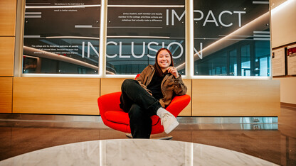 Civil engineering major Kiley Pham smiles for a photo inside Kiewit Hall.