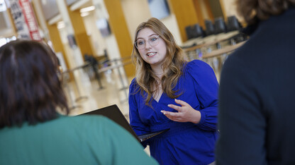 Addie Weiand, Business in Action Job Shadow program, now interning at Crete Carrier, talks with College of Business staff in Howard Hawks Hall.