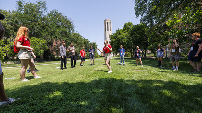 An NSE leader (center) leads a game for incoming Huskers July 15.