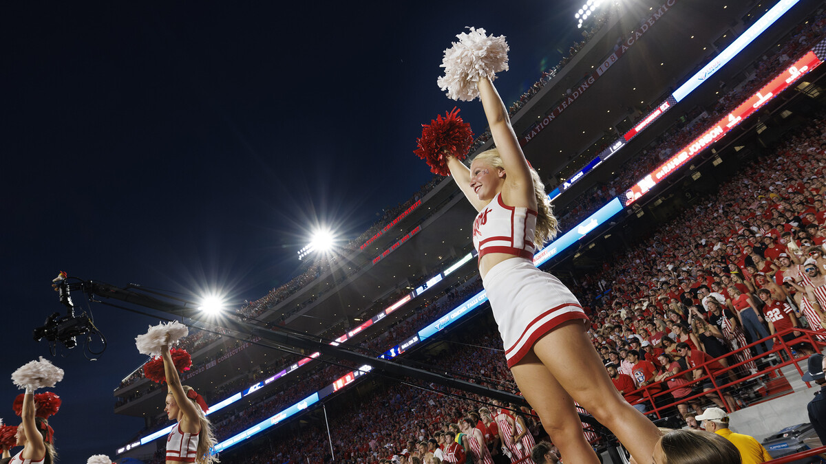 Cheerleaders perform at the football game against Illinois