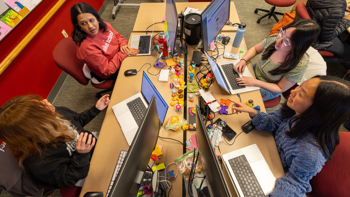 The Raikes School Design Studio team works on creating the AI program for The Buckle, a Nebraska-based clothign retailer. The team includes (clockwise from top left) Radhika Damle, Victoria Chin, Ealynn Hsu and Katie Henrriquez.