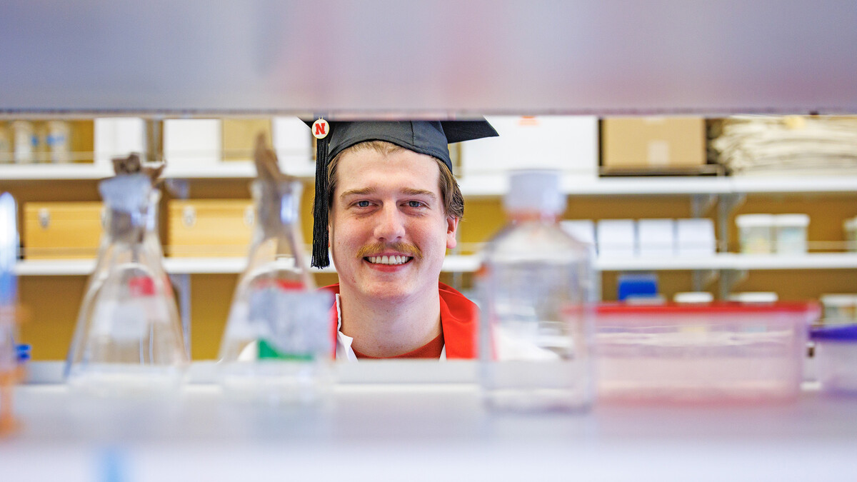 Kai Waddell poses for a portrait at the Morrison Life Sciences Building on East Campus. Waddell is a Microbiology major and is set to graduate this May.
