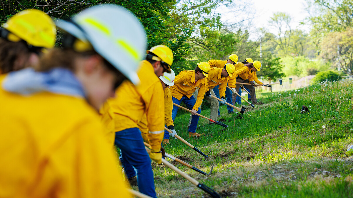 Students in the University of Nebraska–Lincoln’s Prescribed/Wildfire Fire Program dig a fire line during Red Card training on East Campus on the morning of May 7. The course is led by Eric Moul, a fire management specialist with the Nebraska Forest Service. Earning the card is required for wildfire firefighters and shows that the students have demonstrated the necessary skills to work a fire incident.