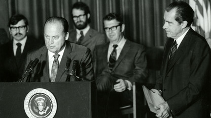 Bob Devaney, then head coach of Husker football, talks after his national championship team was honored by President Richard Nixon (right) during a Jan. 14, 1971 celebration in the Coliseum. Also pictured in the background (seated between Devaney and Nixon) is Joseph Soshnik, the university’s 13th chancellor.