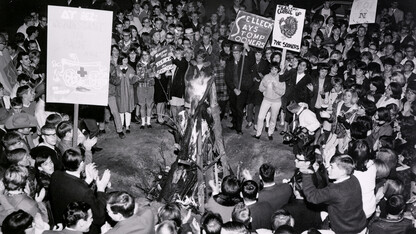 Students rally around a bonfire during a 1966 homecoming celebration held near the Nebraska Union.