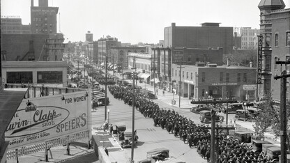 Nebraska graduates parade through downtown Lincoln at the corner of 13th and Q streets in this undated photo taken from atop the Temple Building. 