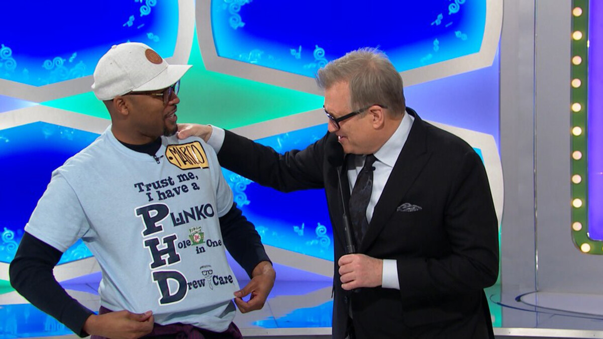 Marco Barker shows 'The Price is Right' host Drew Carey what Ph.D. really stands for. 