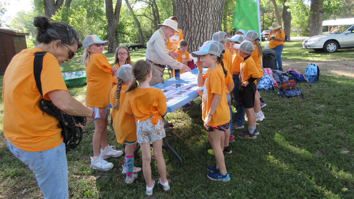 Bob Diffendal leads a group of campers through a nature activity.