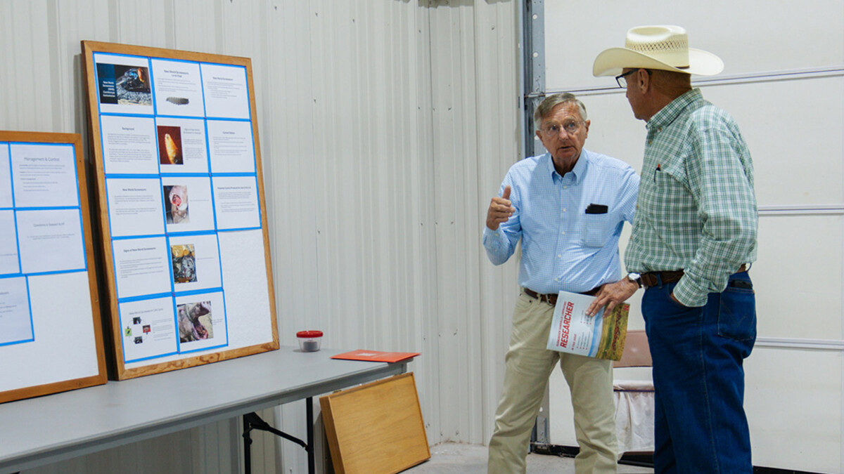 David Boxler (left) discusses fly control with a Nebraska rancher at the Gudmundsen Sandhills Laboratory Open House in Whitman, Neb. 