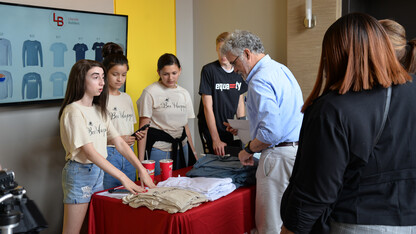 Students participating in the Future Builders Challenge sell their T-shirts during a June 21 pop-up event at The Foundry in downtown Lincoln.