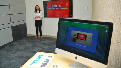 Lexie Heinle, a junior journalism major, uses the UNL One Button Studio on Aug. 26. The new studio in Love Library offers video recording with a single click of a button.