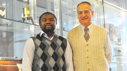 Jean Marcel Ngoko Djiokap (left) and Anthony Starace are co-authors on a study that identified the characteristics of a laser pulse that yields electron behavior they can predict and control.