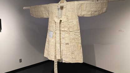 A “hanbok,” or Korean robe constructed of receipts. The piece was crafted by Dong Kyu Kim and is one of the exhibits featured in the Robert Hillestad Textiles Gallery.