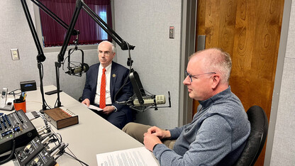 Dr. Jeffrey P. Gold and Shane Farritor sitting in a studio recording an episode of the "Heart to Heart" podcast.