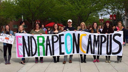 Students pose with a banner during the 2016 End Rape on Campus March at the University of Nebraska–Lincoln.