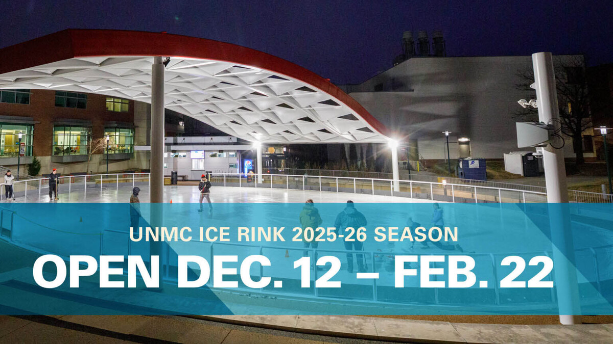 A picture of an outdoor ice rink with a banner showing dates it is open.
