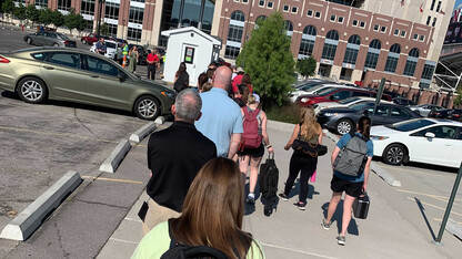 Students, faculty and staff stand in line for COVID-19 re-entry testing on Aug. 16 outside of Memorial Stadium.