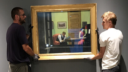 Sheldon employees install "Room in New York" by Edward Hopper. The iconic artwork is featured in the museum's new exhibition, "Sheldon Treasures."