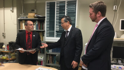 Nebraska's Steve Goddard (left) and Jon Kerrigan (right) meet with a Japanese colleague during an international trade mission in early February.