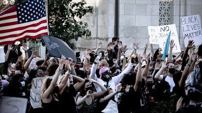 Protesters raise their hands in the air during a May 31 Black Lives Matter protest at the Nebraska State Capitol building. The university will host a discussion about the national protests on June 2.