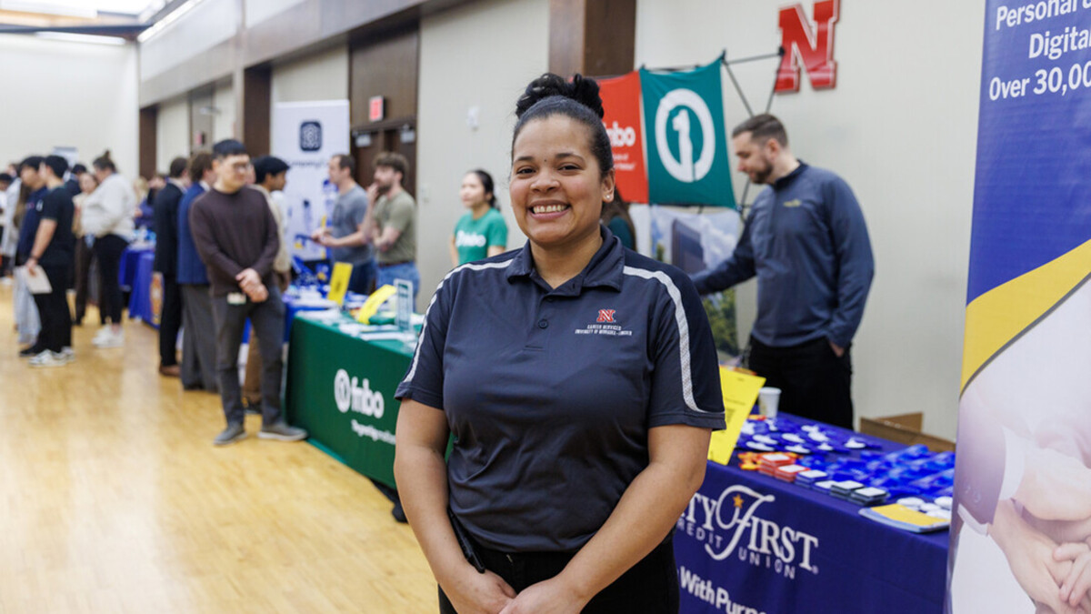 Ronesha Love stands in Nebraska Union during the Career Fair.