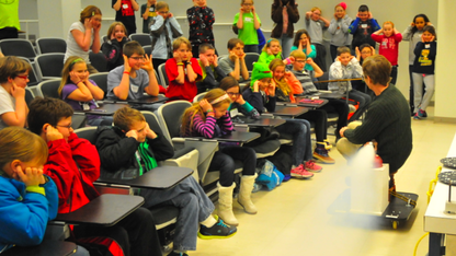 UNL's Cliff Bettis demonstrates how a sudden release of carbon dioxide propels a cart during his Feb. 1 Saturday Science lecture.