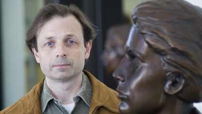 John Sorensen stands next to the bust of Grace Abbott in the entryway of Grand Island's Edith Abbott Memorial Library. Sorensen will discuss the legacy of the Abbott sisters in the March 28 Nebraska Lecture.