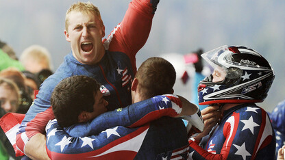 Nebraska's Curt Tomasevicz (center) celebrates with USA-1 teammates after their gold medal finish in the four-man bobsled final at the 2010 Winter Olympics in Vancouver, Canada.